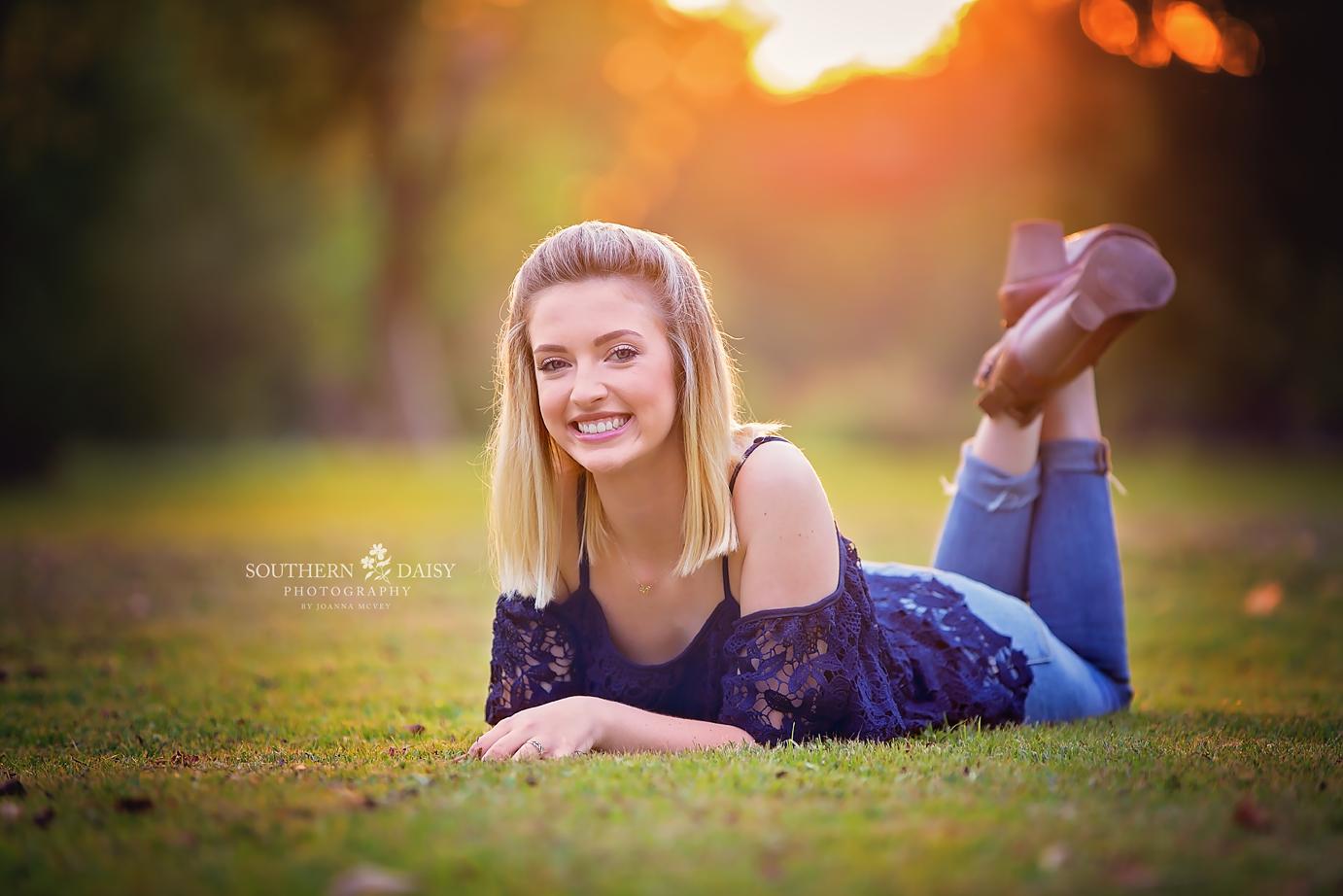 Senior girl laying on stomach with feet up - Hendersonville and Gallatin Senior Photographer