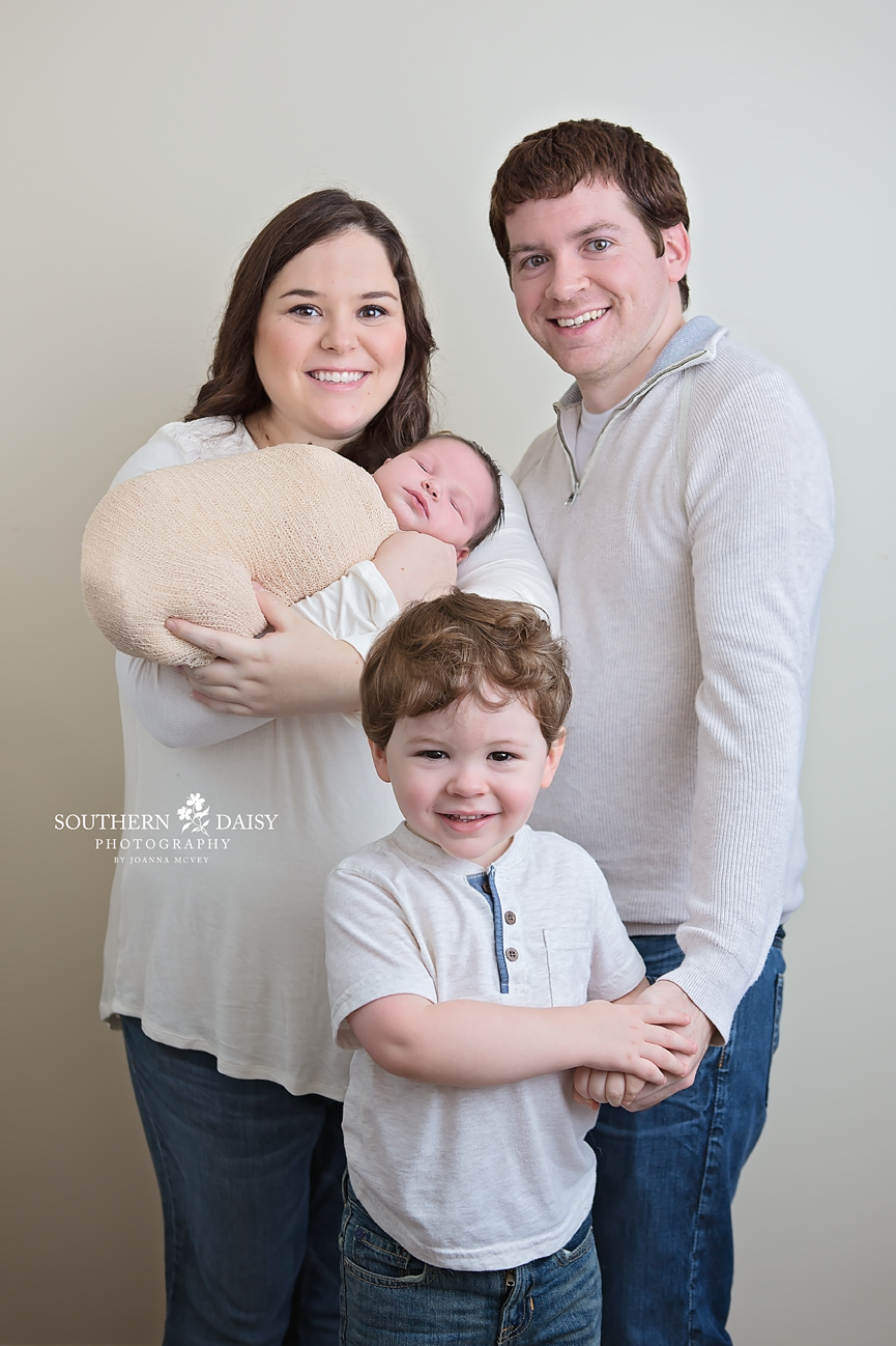 Family with two little boys wearing white in studio - Tennessee Newborn Portraits