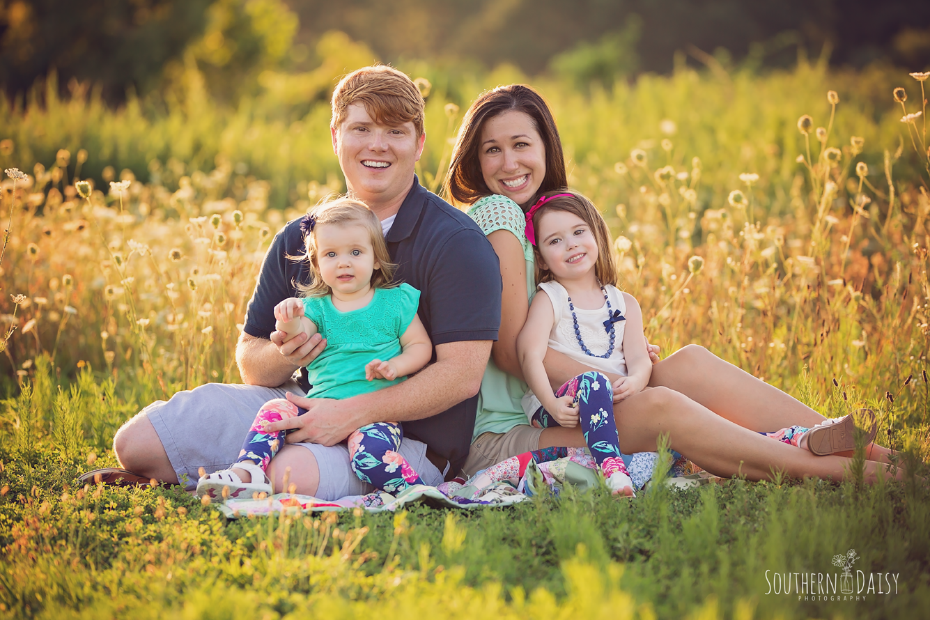family of 4 in field of wildflowers - Nashville Family Photographer