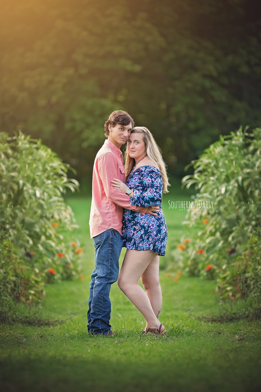 Expectant couple embracing at sunset - nashville maternity portraits