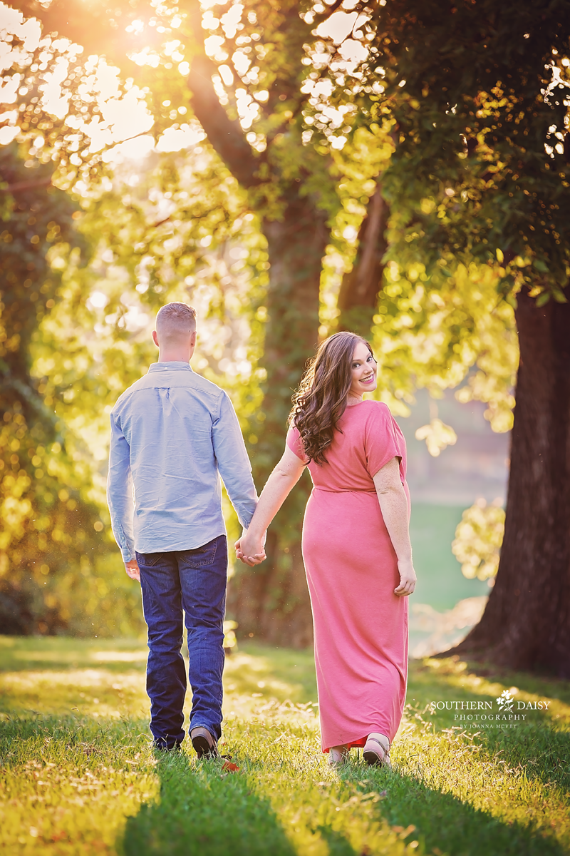 Couple walking with woman looking back over her shoulder - nashville portrait photographer